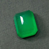 Green gemstone on a dark gray background