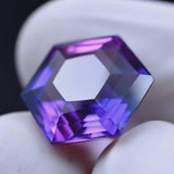 Certified Purple Tanzanite Gemstone 8.55 Ct Fancy Cut Held in Fingers – Excellent Condition