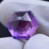 Natural Tanzanite 8.55 Ct Purple Fancy Shape Gemstone Displayed in Hand – Clarity Enhanced