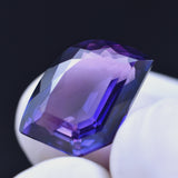 Purple Tanzanite 7.70 Ct Loose Gemstone Held in Fingers – Fancy Cut Eye Clean Stone