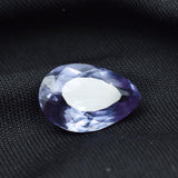 Loose 7.25 Ct Alexandrite gemstone on black background emphasizing brilliance and depth