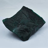 Dark green stone on a white background