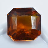 Glistening natural orange sapphire, 8.35 carats, a certified loose gemstone.