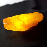 Yellow crystal on a black background