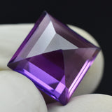 Natural Purple Tanzanite 10.65 Carat Square Cut Loose Gemstone Held in Hand – Certified