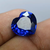 Blue Tanzanite Heart Shaped Gemstone Displayed on Hand - Natural, Certified, Clarity Enhanced