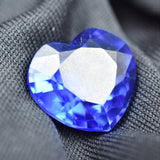 Natural Blue Tanzanite Heart Shape 10.00 Carat Certified Loose Gemstone on Grey Surface