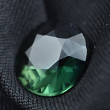 Round-shaped deep green sapphire, 5.40ct, a natural certified loose gemstone.