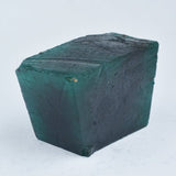 Green Emerald Rough held in hand scale product shot