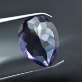 Certified Russian Alexandrite 10.12 Ct Held by Jewelry Pin – Pear Shape, Color-Change Translucent Gem