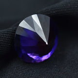 Purple gemstone on a black background