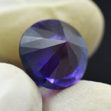 Flipped View of 9.30 Ct Purple Tanzanite Round Cut Gemstone Held in Hand - Certified Stone