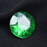 Natural Green Garnet 8.85 Ct displayed on a plain black background, round cut loose gemstone