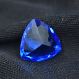Loose Natural Tanzanite Gemstone 5.10 Ct Blue Trillion Cut on Black Surface – Excellent Condition