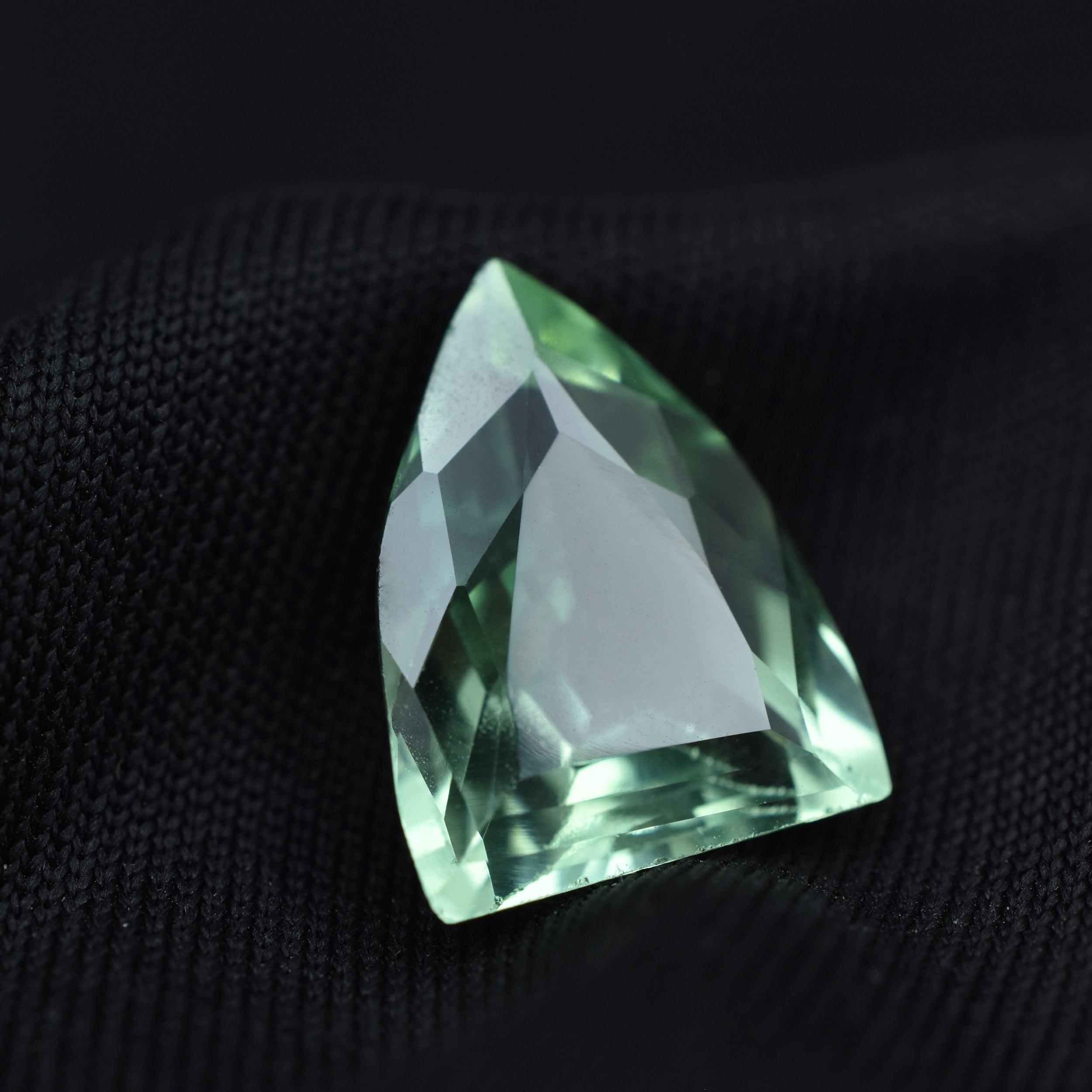 Certified 6.45ct fancy-cut natural Montana sapphire, a bluish-green loose gemstone.