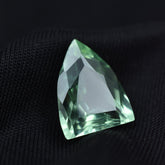Certified 6.45ct fancy-cut natural Montana sapphire, a bluish-green loose gemstone.