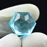 13.56 Carat Aquamarine Octagon Gem Held Between Fingers for Display