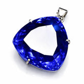 Blue gemstone pendant on a white background
