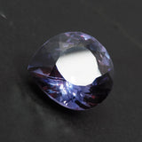 Color change Alexandrite loose gemstone placed on black background highlighting brilliance