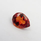 Pear-shaped 9.45ct orange sapphire.