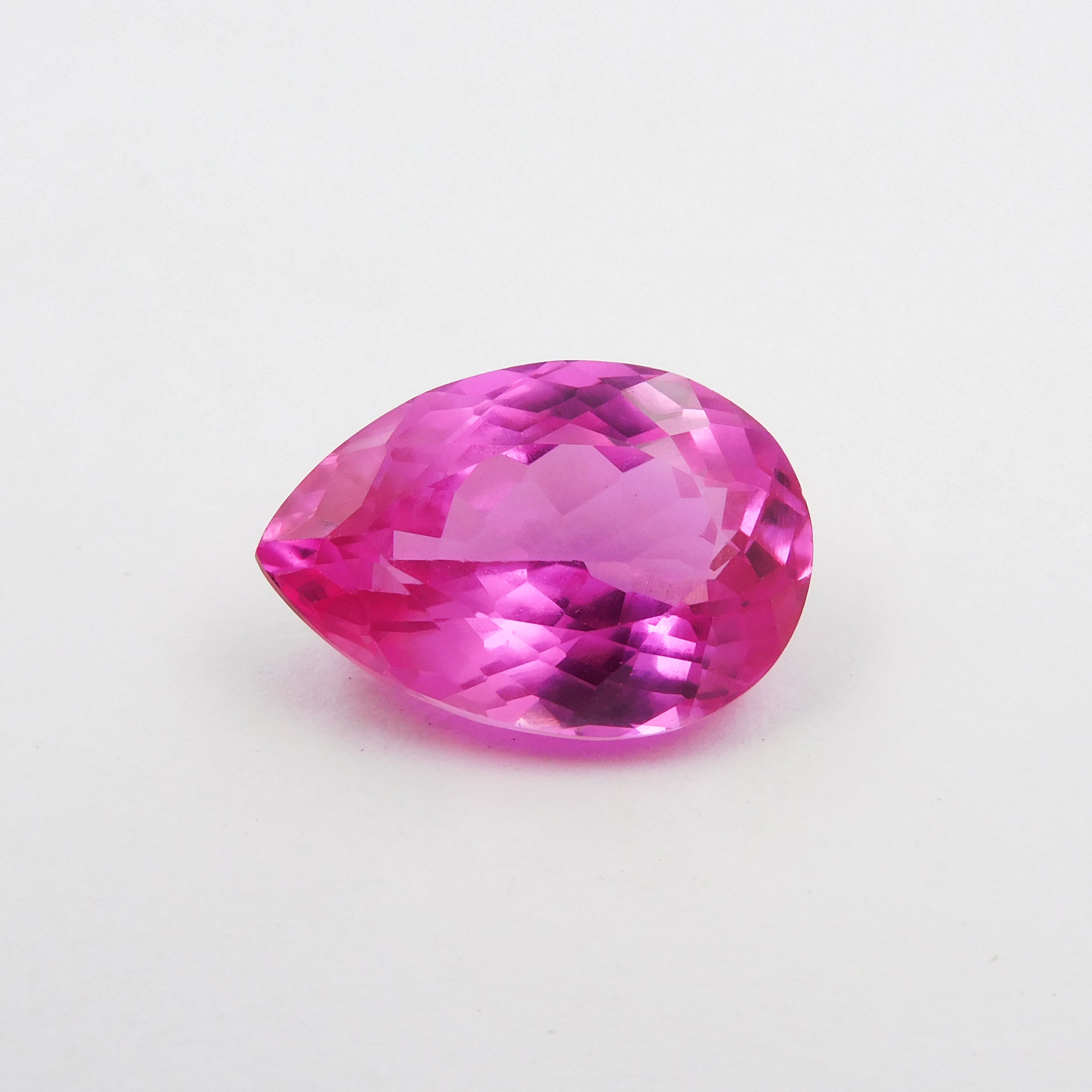 A pink pear-cut natural sapphire gemstone