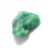 “Unpolished green beryl mineral chunk with irregular surface.”