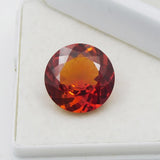 Round-cut orange sapphire, 8.50 carats, a certified loose gemstone
