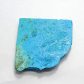 “Flat slab of natural turquoise stone with blue and green matrix patterns on a white background.”
