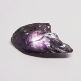 Amethyst crystal on a light gray background