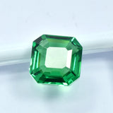Certified 10.62 Carat Green Garnet placed on a white bordered box with transparent sheet, square cut view