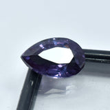 8.70 Carat Natural Pear Shape Alexandrite placed on corner of black-bordered box with transparent center