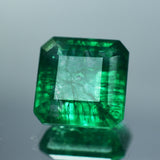 Emerald gemstone reflecting light – vibrant green certified square gem