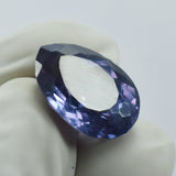 6.15 Carat Alexandrite Held Between Two Gloved Fingers – Pear Cut Color-Change Natural Gemstone