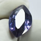 5.75 Carat Marquise Cut Alexandrite Held Between Two Gloved Fingers – Natural, Translucent Gemstone