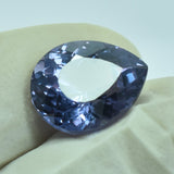 7.60 Carat Alexandrite Gemstone Held Between Gloved Fingers – Certified Color-Change Pear Cut Gem