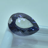 Certified Alexandrite 8.65 Ct Pear Cut Gem on Clean White Surface – Color-Change Natural Gemstone