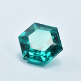 Fancy shaped Green Tsavorite Garnet 9.10 Ct placed on a plain white background, translucent and clarity enhanced