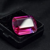 Emerald-cut natural bi-color sapphire, 29.05ct, a certified loose gemstone.