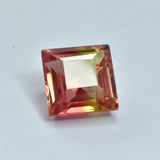 Multicolored square-cut gemstone on a light gray background