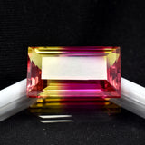 Certified 23.20ct natural emerald-cut bi-color sapphire, a loose gemstone.