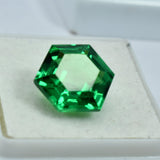 Vibrant green gemstone positioned against a rich black background, enhancing its color depth and clarity