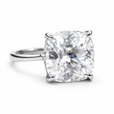 Diamond ring with a cushion-cut gemstone on a white background