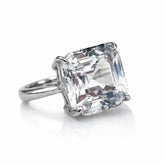 Diamond ring with a large, clear gemstone on a white background