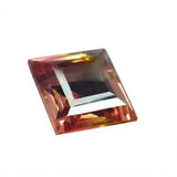 Multicolored square-cut gemstone on a white background