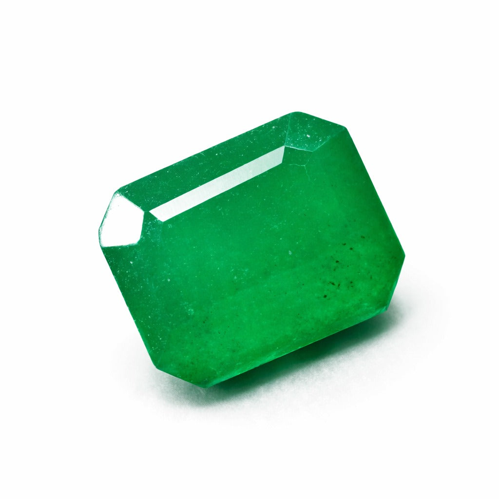 colombian emerald natural gemstone Faceted green gemstone on a white background