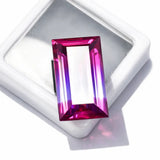 Rectangular pink gemstone in a white setting