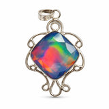 Multicolored opal pendant with silver frame on white background