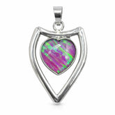 Silver pendant with a heart-shaped opal stone on a white background