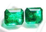 Front angle view of both emeralds with minor positioning variation to highlight cut and transparency.