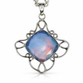 Silver pendant with a blue gemstone on a white background